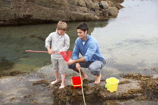 Father and son on beach
