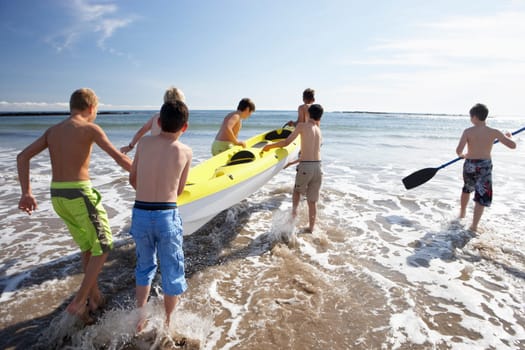 Teenage boys kayaking