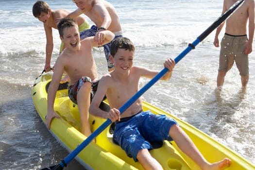 Teenage boys kayaking