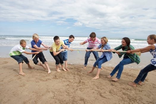 Teenagers playing tug of war