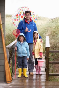 Father with children on beach