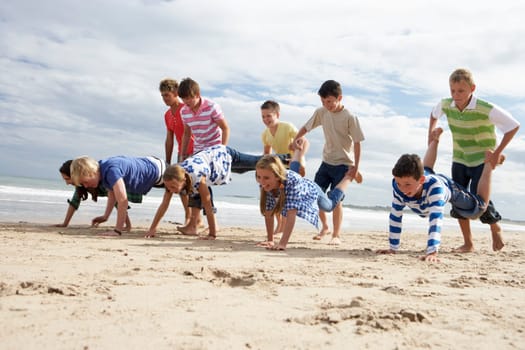 Teenagers playing on beach