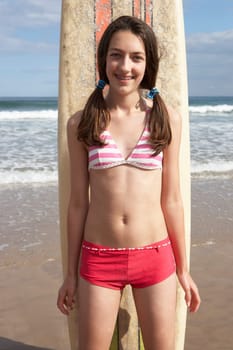 Teenager girl with surf