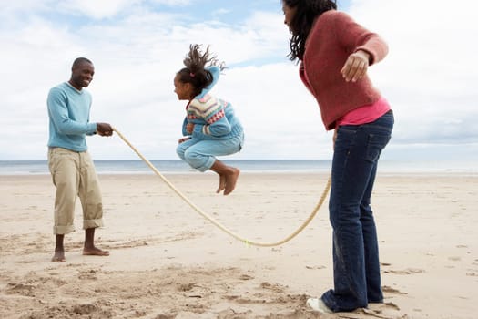 Family playing on beach