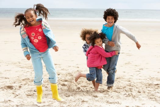 Happy children playing on beach
