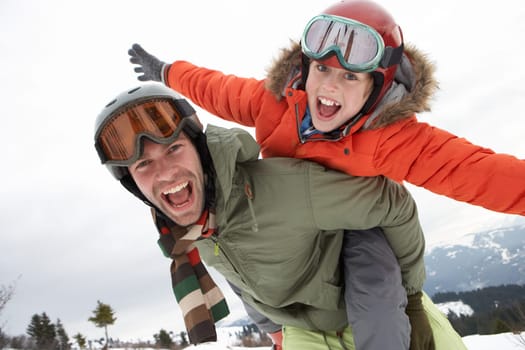 Young Father And Son On Winter Vacation