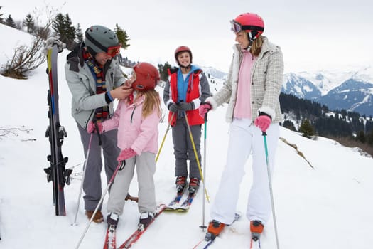 Young Family On Ski Vacation