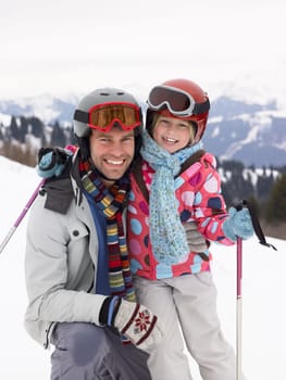 Young Father And Daughter On Ski Vacation