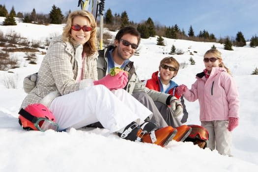 Young Family On Ski Vacation