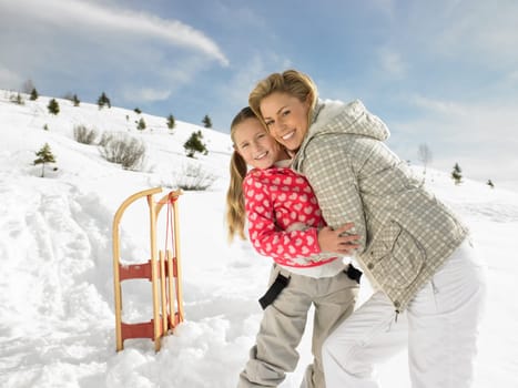 Young Mother And Daughter On Winter Vacation