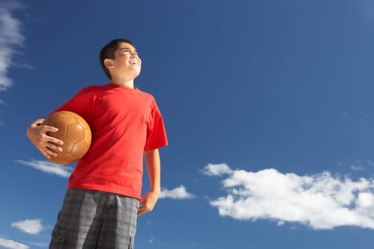 Teenage boy holding football