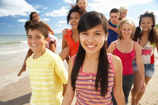 Teenagers walking on beach