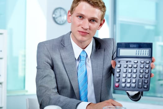 Portrait of a successful employer with calculator looking at camera