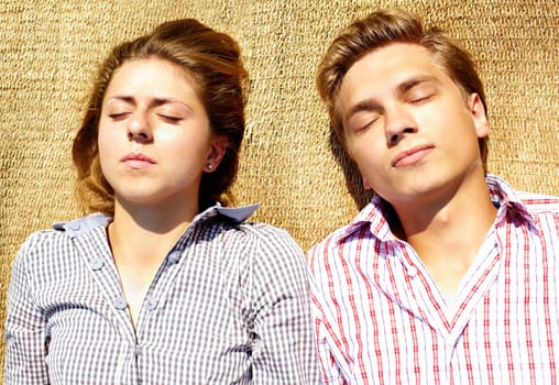 Portrait of young couple having a nap