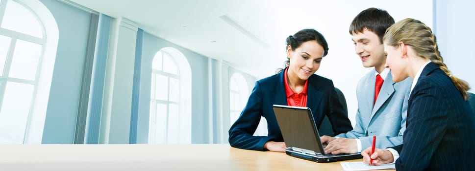 Portrait of business people interacting together on the background of office building