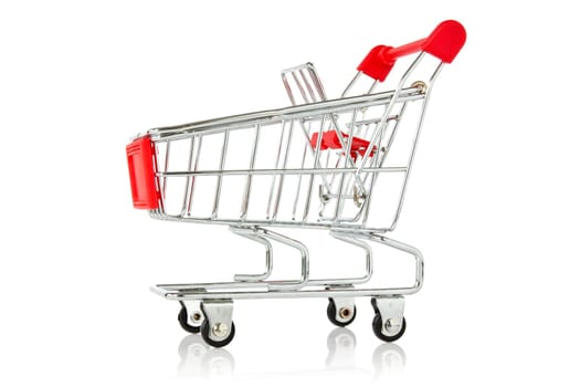 empty shopping cart with reflection on white background