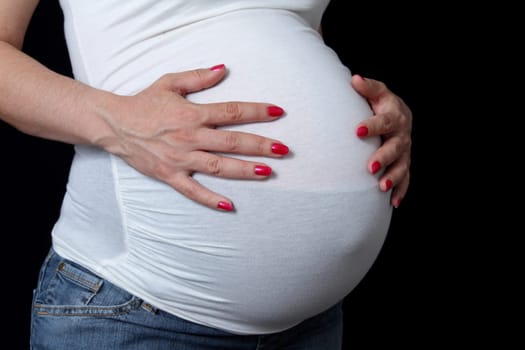 details of side view of a belly of pregnant woman