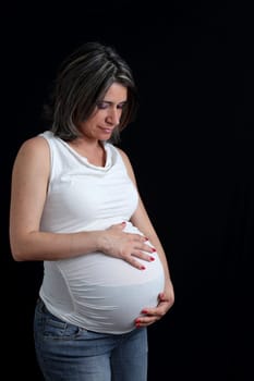 details of side view of a belly of pregnant woman