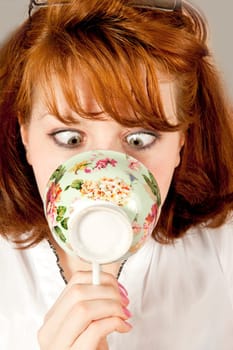 Youn woman with cup of tea