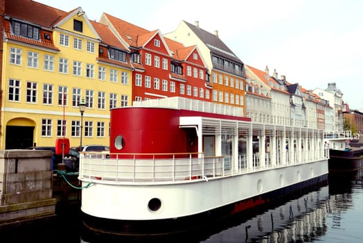 Boatsi in the canal of Nyhavn in Copenhagen, Denmark. Taken on May 2012.