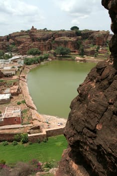 View of historical lake and northern hill at Badami, Karnataka, India, Asia