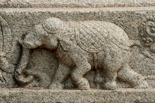 Sculpture of lively action of running elephant on the wall of Mahanavami Dibba at Hampi, Karnataka, India, Asia
