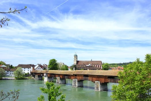 the famous covered wooden bridge over the Rhine from the German bank of Bad Säckingen to the Swiss bank