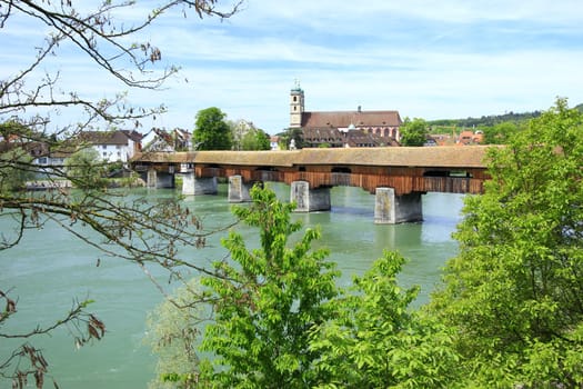 the famous covered wooden bridge over the Rhine from the German bank of Bad Säckingen to the Swiss bank