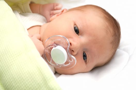 Closeup of Newborn Baby With Dummy