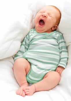 Yawning New Born Baby in the Bed