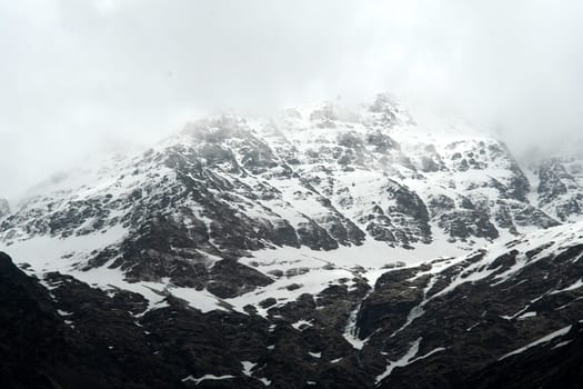 Snow covered Himalayan Mountain viewed from trekking path to Yamunothri, Uttarakahand, India, Asia
