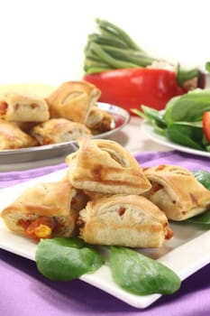 spicy puff pastry snacks with bell pepper and vegetable filling