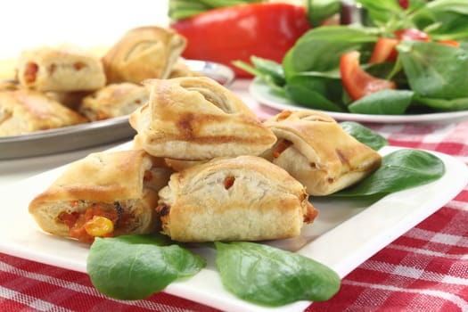 spicy puff pastry snacks with bell pepper and vegetable filling