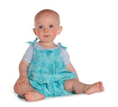 Cute little baby with blue eyes sitting on white background