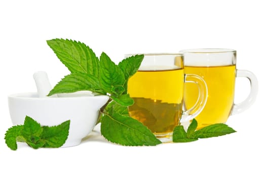 Pestle and mortar with freshly crushed lemon balm leaves used to brew healthy refreshing mint or lemon balm tea or tisane with medicinal and aromatherapy properties
