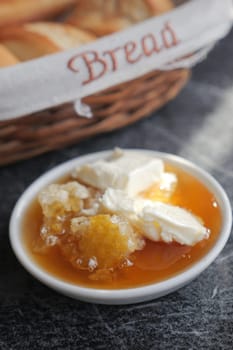 butter cream and honey in a bowl on table