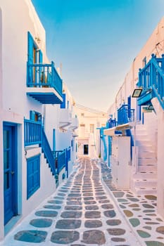 empty street of Mykonos Greek village in Greece, colorful streets of Mikonos village during sunrise