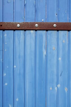 A wooden islander blue door closeup used as background