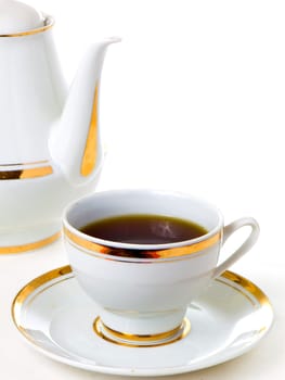 Tea and a teapot isolated on white background