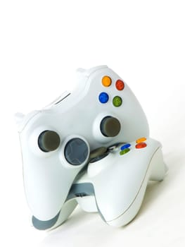 Two console's white gamepads isolated on white background