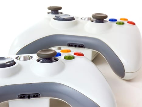 Two console's white gamepads isolated on white background