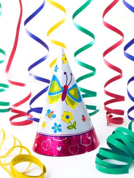 Hats and colorfull ribbons for kid's party, isolated on white background
