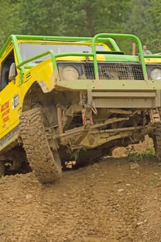 MOHELNICE, CZECH REPUBLIC - JUNE 10. Unidentified racer at yellow off-road car leaves steep slope in the "SHOCK CUP Trial 2012"" on June 10, 2012 in the town of Mohelnice, Czech Republic."