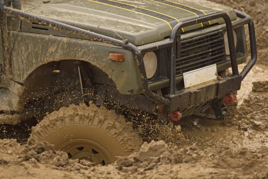 MOHELNICE, CZECH REPUBLIC - JUNE 10. Unidentified racer at off-road car passes through muddy puddles in the "SHOCK CUP Trial 2012"" on June 10, 2012 in the town of Mohelnice, Czech Republic."
