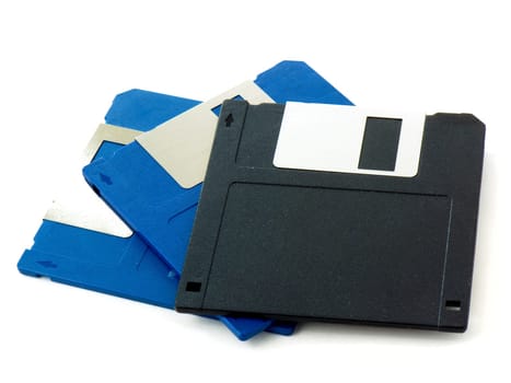 Tree blue and black old floppy disks isolated on white background