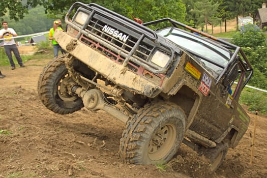 MOHELNICE, CZECH REPUBLIC - JUNE 10. Unidentified racer at off-road car leaves steep slope in the "SHOCK CUP Trial 2012"" on June 10, 2012 in the town of Mohelnice, Czech Republic."