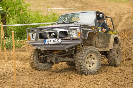 MOHELNICE, CZECH REPUBLIC - JUNE 10. Unidentified racer at off-road car in difficult muddy terrain in the "SHOCK CUP Trial 2012"" on June 10, 2012 in the town of Mohelnice, Czech Republic."