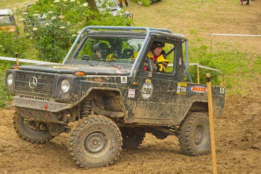 MOHELNICE, CZECH REPUBLIC - JUNE 10. Unidentified racer at off-road car leaves steep slope in the "SHOCK CUP Trial 2012"" on June 10, 2012 in the town of Mohelnice, Czech Republic."