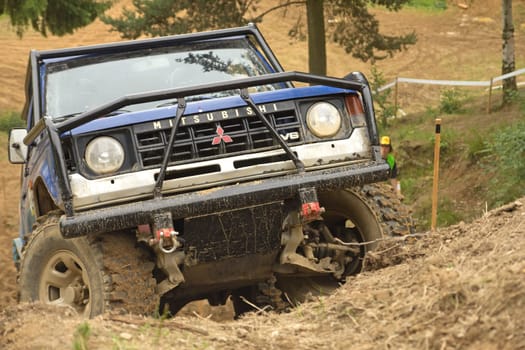 MOHELNICE, CZECH REPUBLIC - JUNE 10. Unidentified racer at off-road car leaves steep slope in the "SHOCK CUP Trial 2012"" on June 10, 2012 in the town of Mohelnice, Czech Republic."