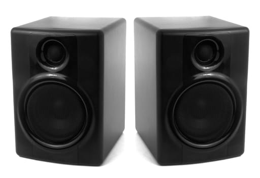 Two black monitor stereo speakers isolated on white background